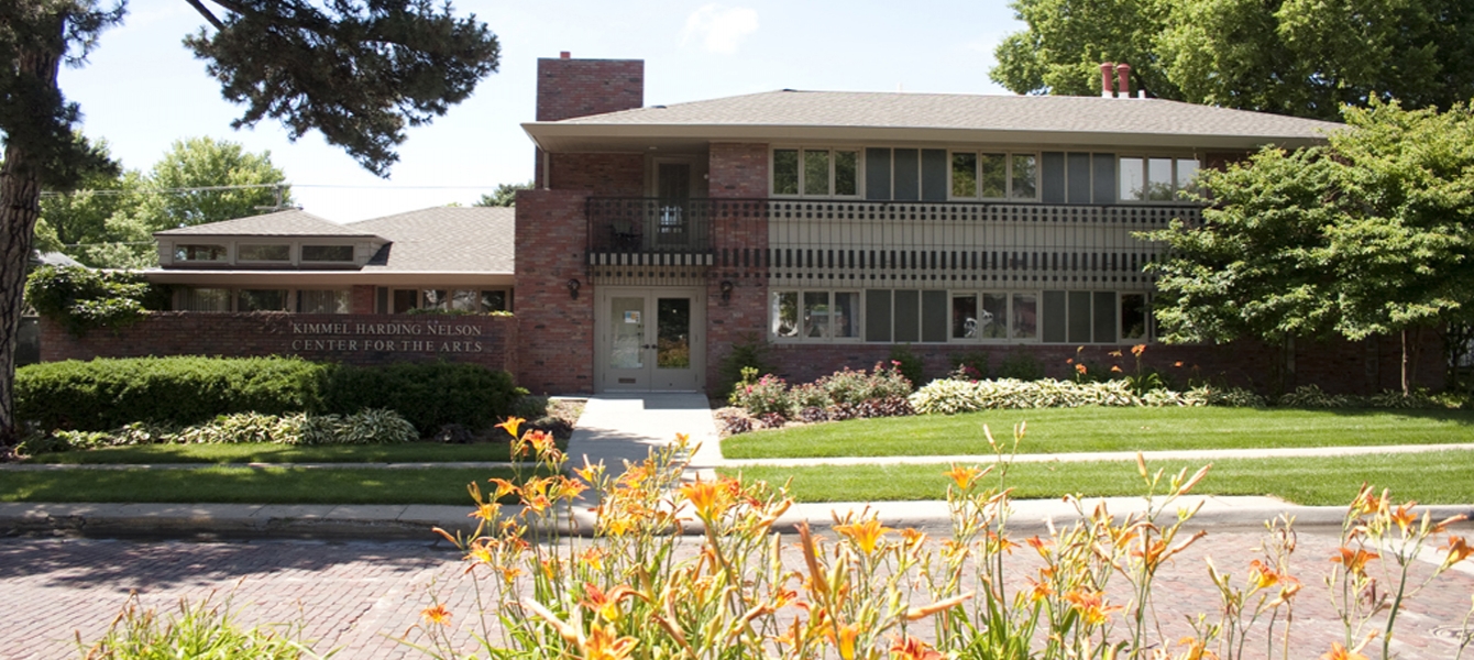 khn center building with flowers in foreground and trees around